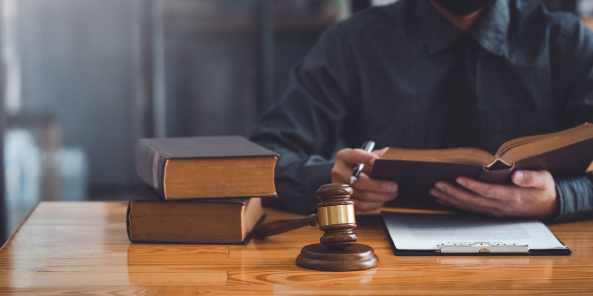 lawyer-working-on-a-document-in-the-office-legal-2023-01-24-22-15-43-utc-min.jpg